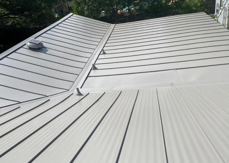 Solar attic fan installed on a metal roof for Roof Ventilation in Petersburg